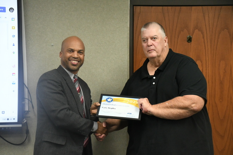Dr. Perry Hill awarding Vice President, Gary Kepley