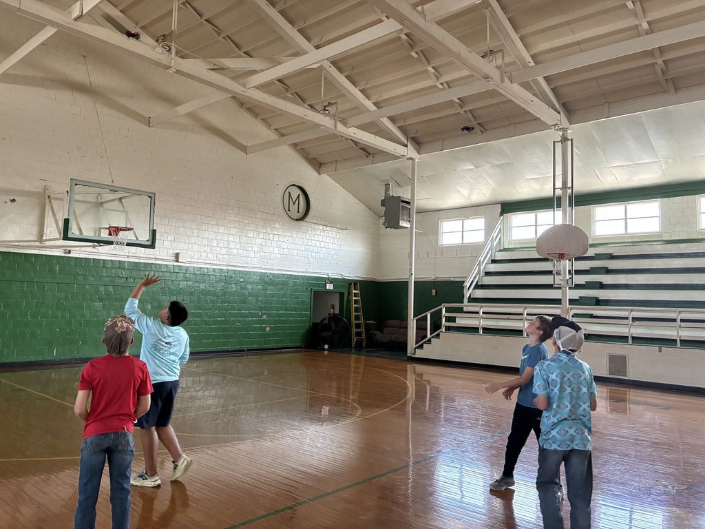 Sixth Grade STEM Class learning how to operate drones.