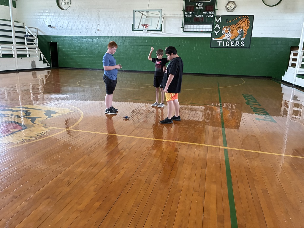 Sixth Grade STEM Class learning how to operate drones.