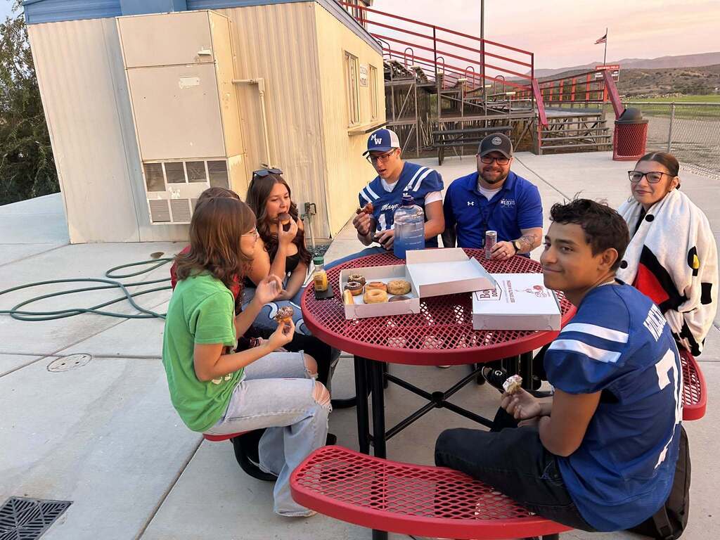 students eating donuts