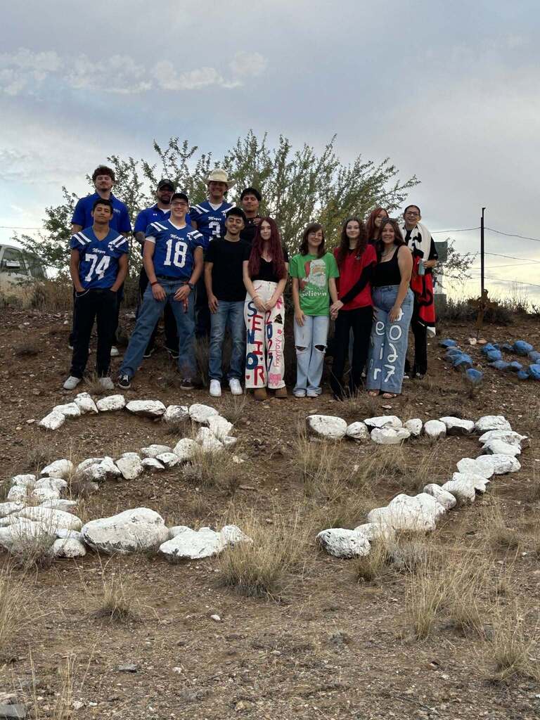 Class of 2027 posing for picture in front