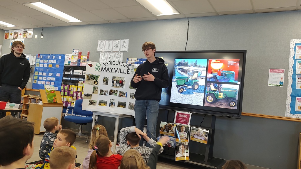MHS FFA students visited our 5K classes down the hill at MES to extend their learning about farms during one of their recent Science/ELA units. Our high schoolers presented their real life experiences from farm animal care to tractor restoration, and even connecting the dots between the snacks the kids eat and what crops are used to create those snacks! (Tractor restoration presentation)
