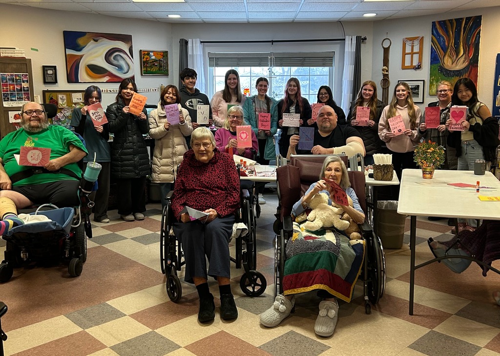 MHS FBLA visits Crossroads Care Center/Avina of Mayville to spread some Valentine's Day love to residents there. The students shared homemade cards. Group photo of residents and students. 