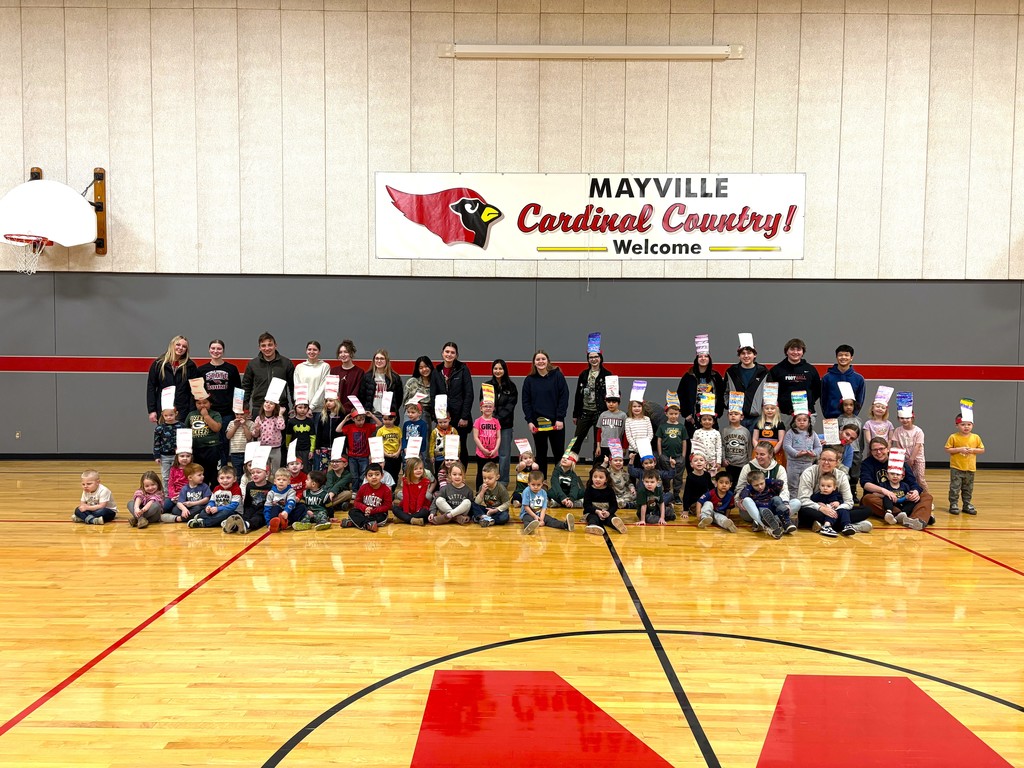 Group photo of 3K and 4K students and MHS National Honor Society students from Read Across America Day in Parkview gym with Dr. Seuss hats