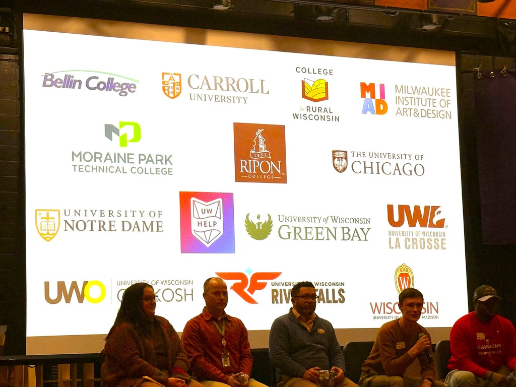 College2U Roadshow Photos - Panelists on stage with all logos on screen