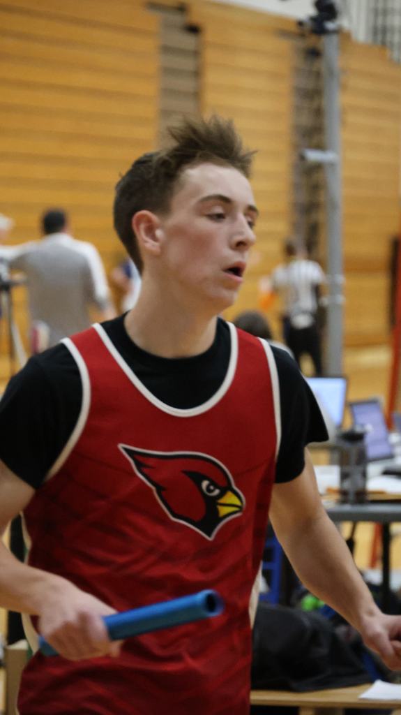 Watertown Indoor Track Meet in Watertown gym with Mayville Cardinal competitors running, relays, hurdles and high jump