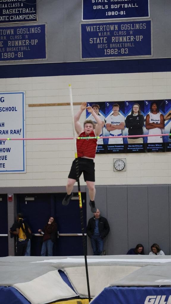 Watertown Indoor Track Meet in Watertown gym with Mayville Cardinal competitors running, relays, hurdles and high jump