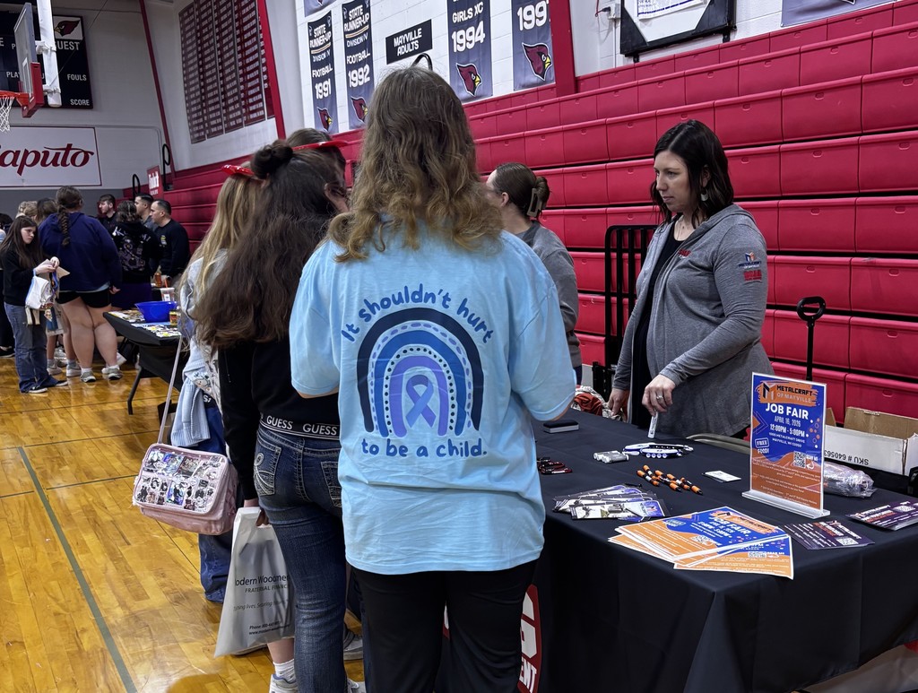 ACP Day Career Fair in MHS gymnasium - students talking with career vendors