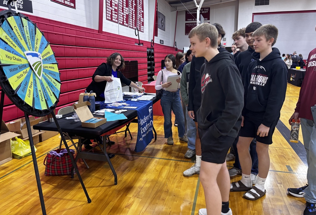 ACP Day Career Fair in MHS gymnasium - students talking with career vendors
