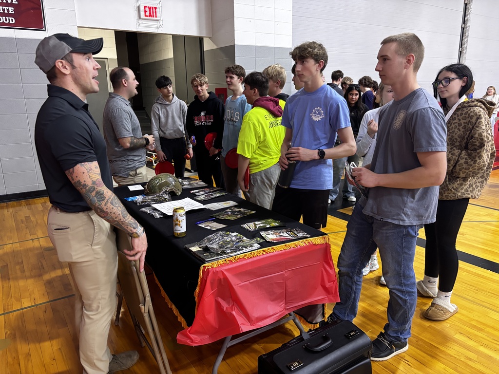 ACP Day Career Fair in MHS gymnasium - students talking with career vendors