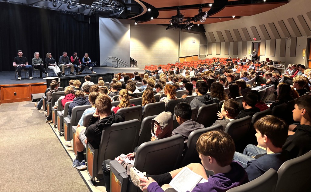 ACP Day Career Fair in MHS gymnasium - students talking with career vendors