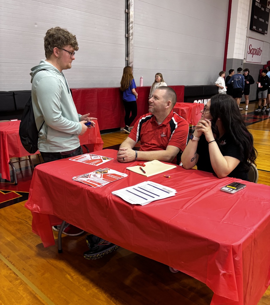 ACP Day Career Fair in MHS gymnasium - students talking with career vendors
