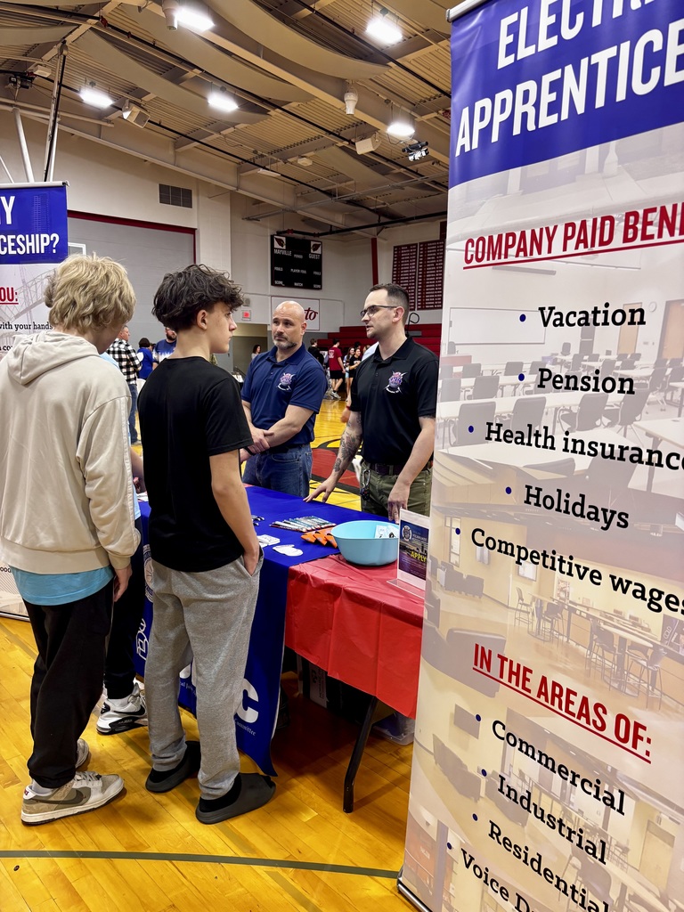 ACP Day Career Fair in MHS gymnasium - students talking with career vendors