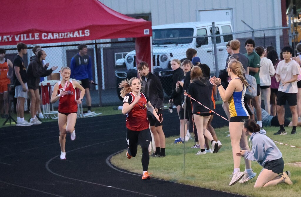 High school student track athletes competing at the Conference Track Meet