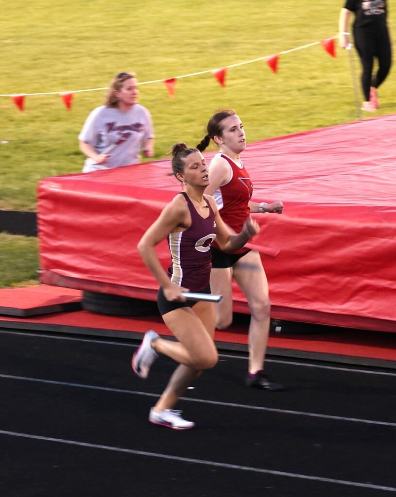 High school student track athletes competing at the Conference Track Meet