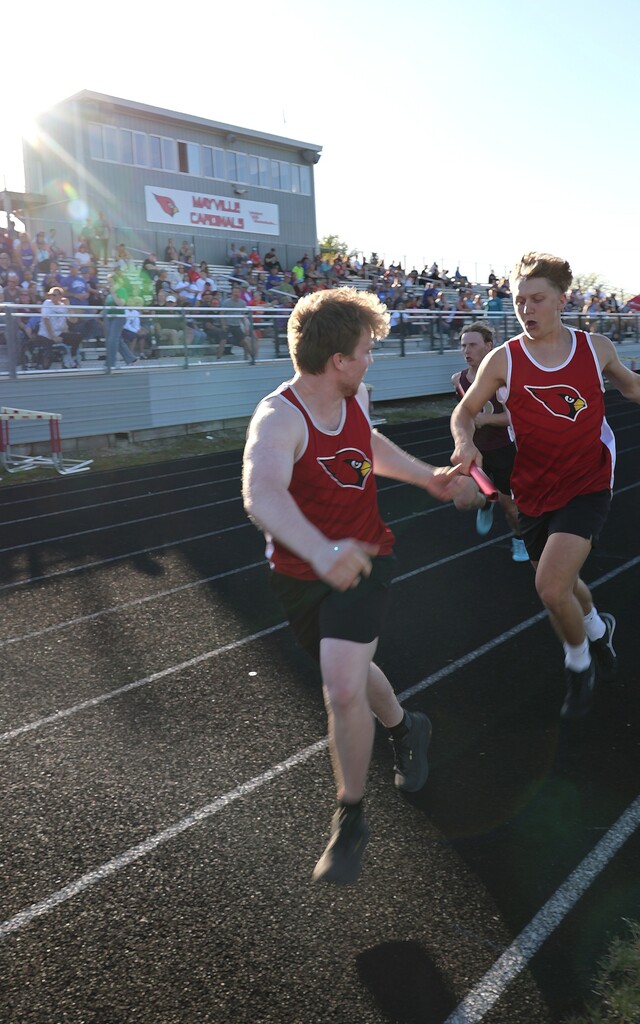 High school student track athletes competing at the Conference Track Meet