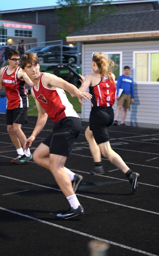 High school student track athletes competing at the Conference Track Meet