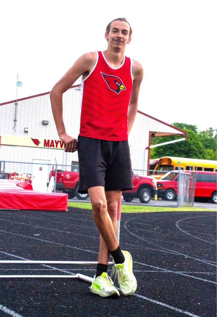 Mac L. state qualifier in Mayville Track uniform on MHS track practicing hurdles for State meet
