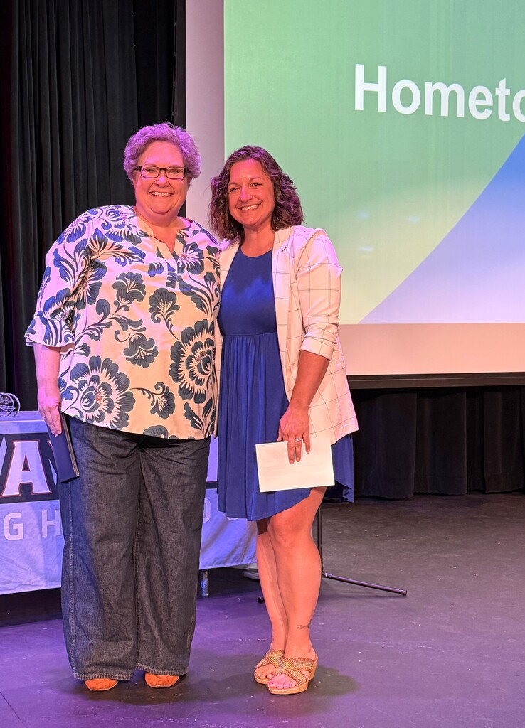 Hometown Hero award recipient Becky Le Bouton with Modern Woodmen representative Christina Hilber who presented Mrs. Le Bouton with the award onstage at MHS