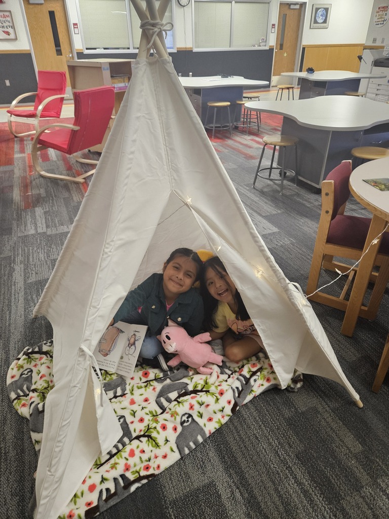 Children reading and smiling, creating reading nooks, tents and homemade lanterns