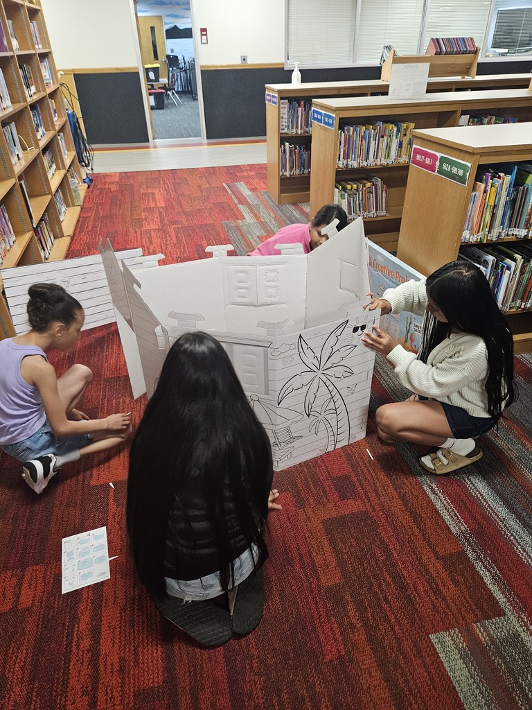 Children reading and smiling, creating reading nooks, tents and homemade lanterns