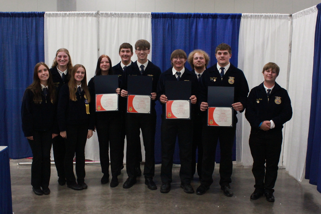 FFA students smiling at FFA State Convention in June holding State Degree Awards