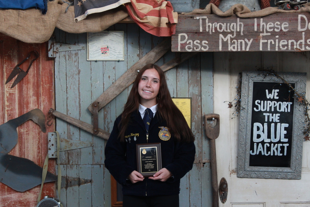 FFA students smiling holding their gold proficiencies medals