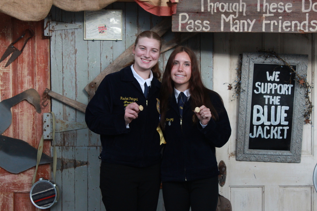 FFA students smiling holding their gold proficiencies medals