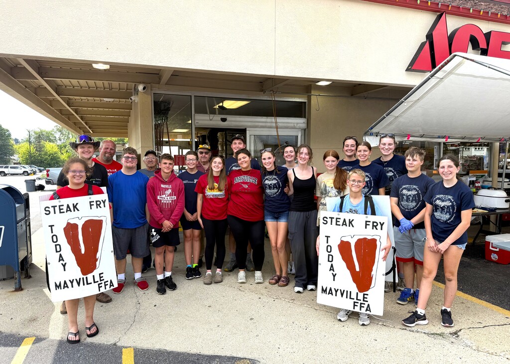 FFA Steak Fry students alumni staff smiling and holding signs