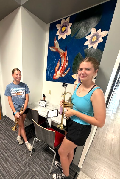MHS Band Camp students playing instruments, practicing the halftime routine on the football field, and marching