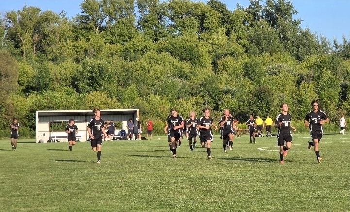 MHS Soccer Team defeated Cedar Grove-Belgium on 8/25 (boys playing on soccer field)