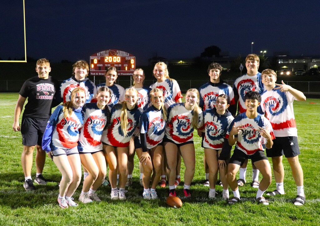 Senior Powder Puff Football participants smiling in tie dyed shirts