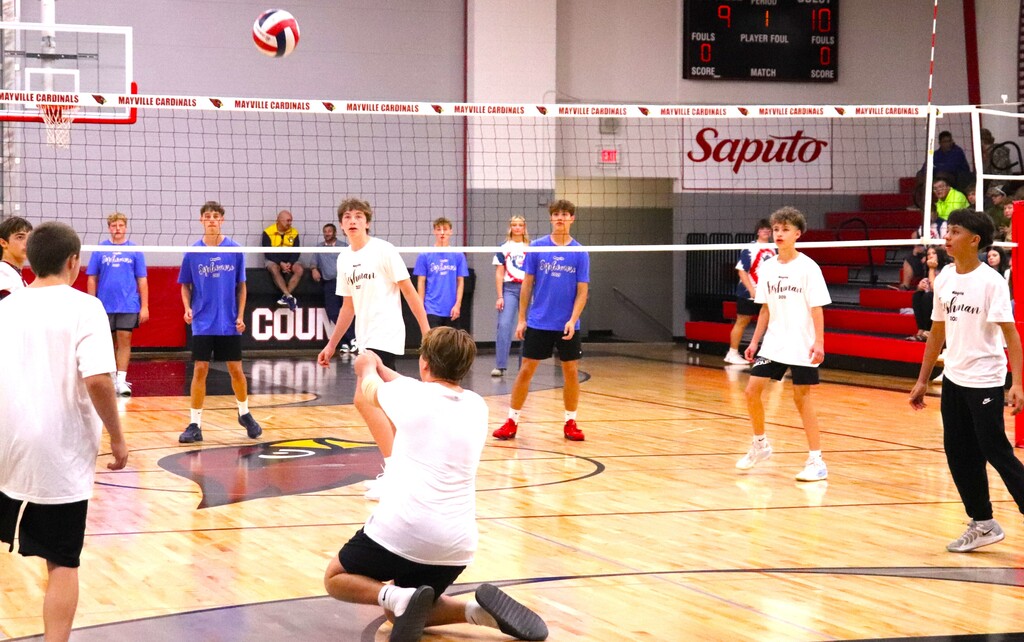 Powder Puff Volleyball 2026 students in class shirts competing in the MHS gym