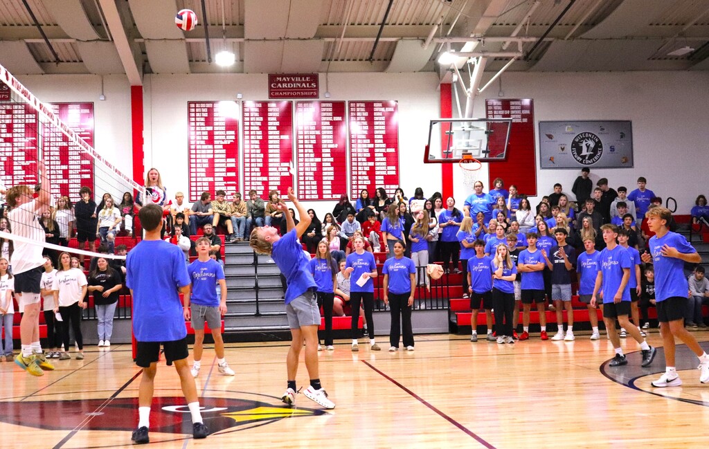 Powder Puff Volleyball 2026 students in class shirts competing in the MHS gym