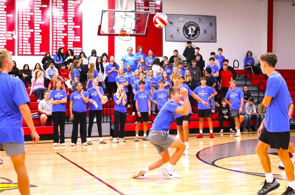 Powder Puff Volleyball 2026 students in class shirts competing in the MHS gym