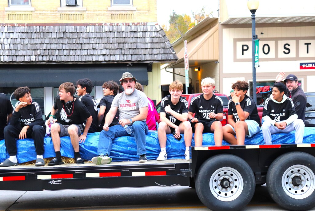 2026 Homecoming Parade down Main St in Mayville with students marching, riding, smiling and school spirit