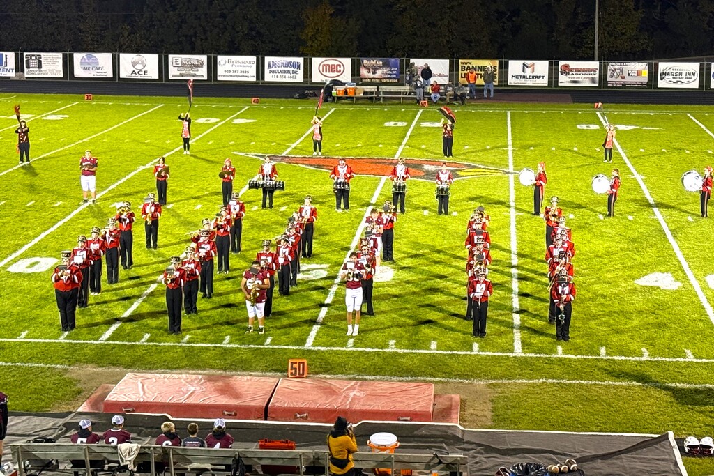 HOCO 2026 Friday Night Football game photos including the pep band, field show, Homecoming court and Big Red