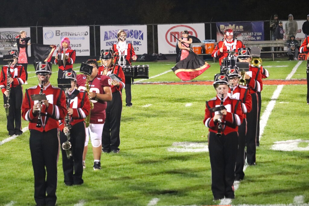 HOCO 2026 Friday Night Football game photos including the pep band, field show, Homecoming court and Big Red