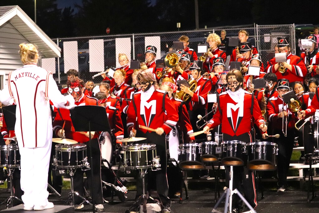 HOCO 2026 Friday Night Football game photos including the pep band, field show, Homecoming court and Big Red