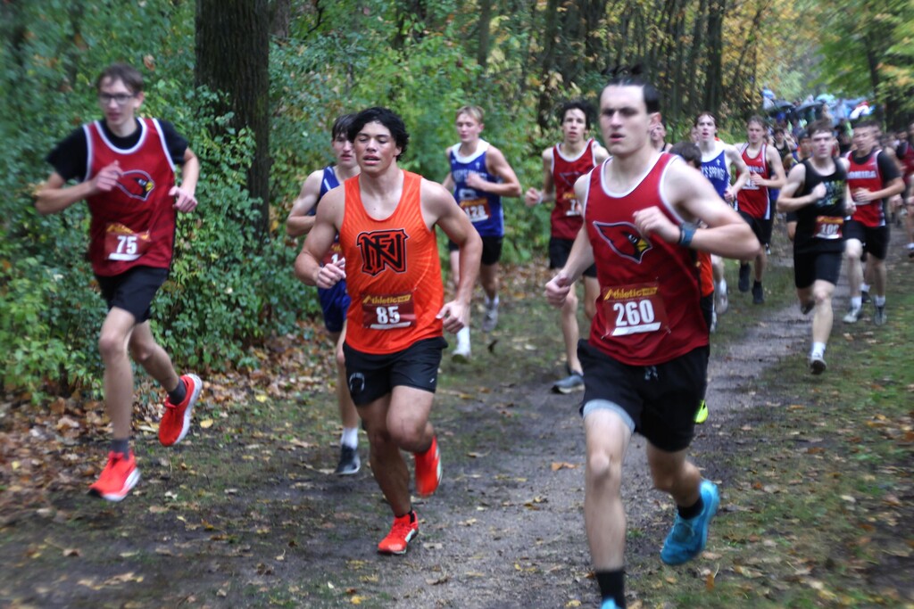 MHS Cross Country running at rainy muddy wet Conference Meet on 10/15/26