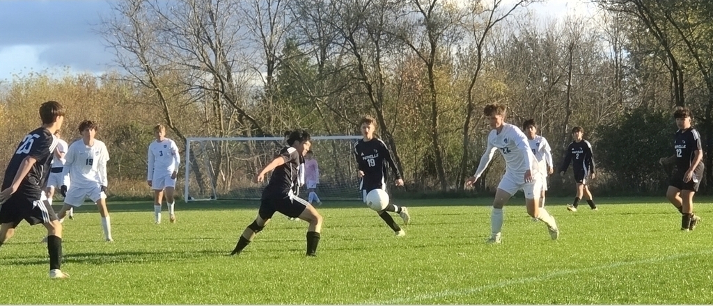 MHS Boys Soccer vs. Lake Mills at home final regular season game 10/16/26 student athletes playing on sunny soccer field with fall background