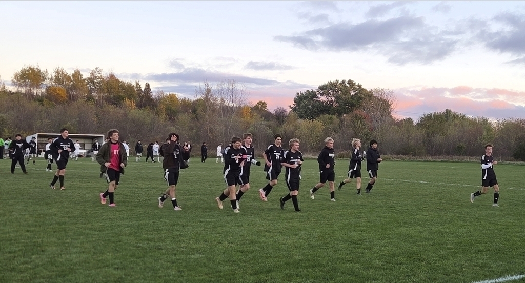 MHS Boys Soccer vs. Lake Mills at home final regular season game 10/16/26 student athletes playing on sunny soccer field with fall background