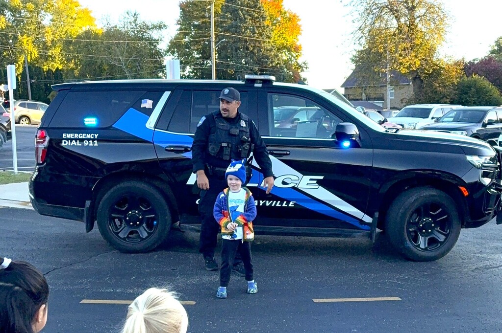 PTO Bubble Run Top 4K Fundraiser Myron C. winner ride to school in a police car