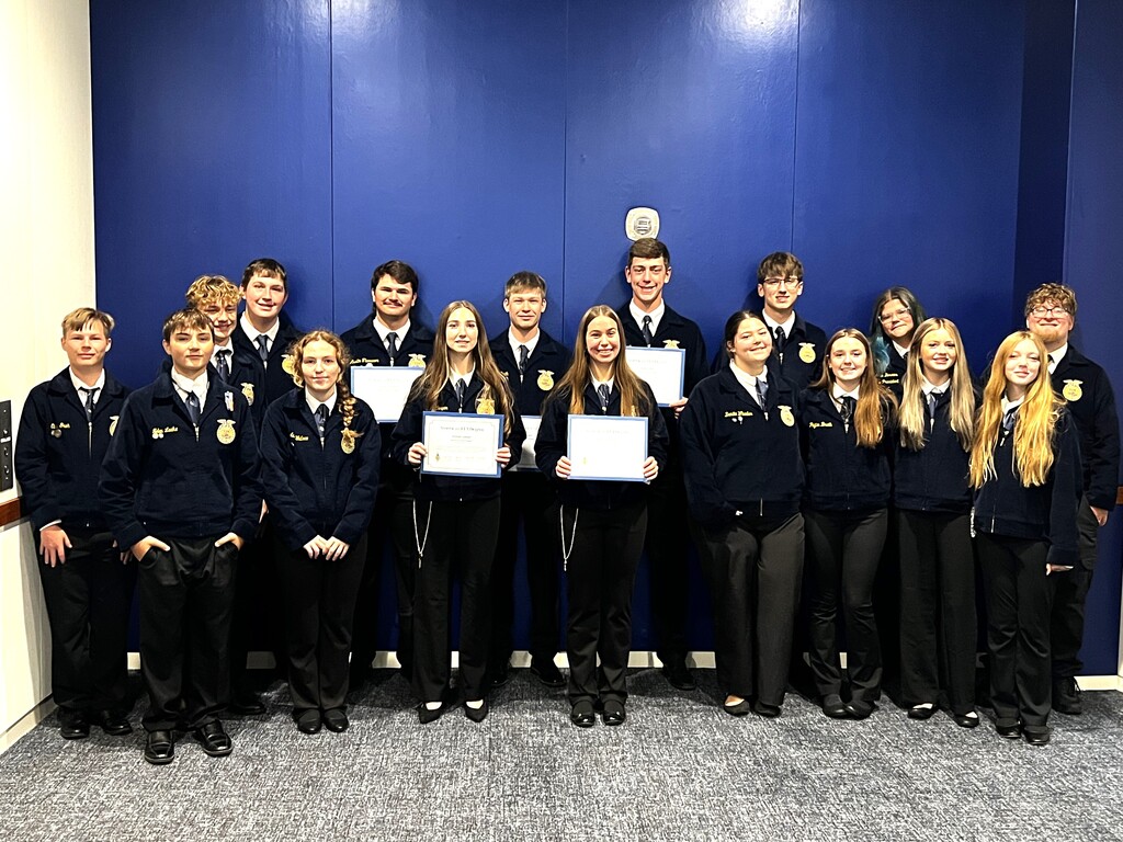 Mayville FFA National Convention attendees, American Degree recipients and our very own state officer (FFA students standing in their official dress and smiling)