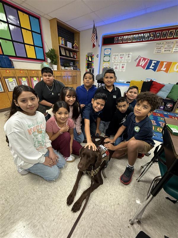 Kids posing with Officer Penny.