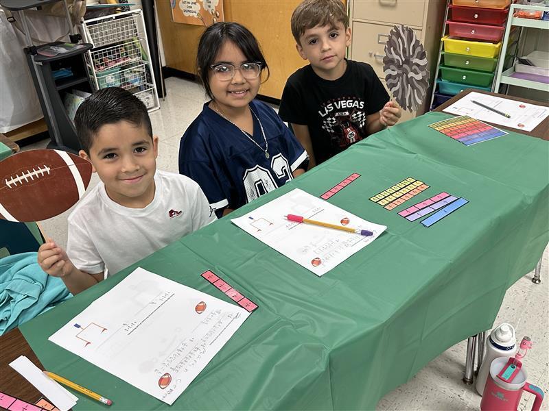 Kids posing for math activity.