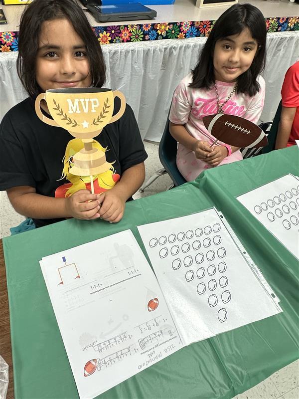 Kids posing for math activity.