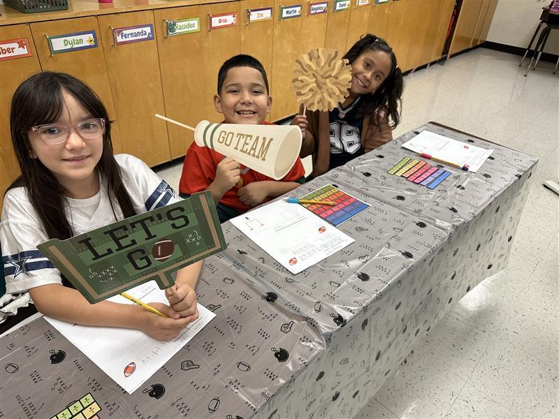 Kids posing for math activity.