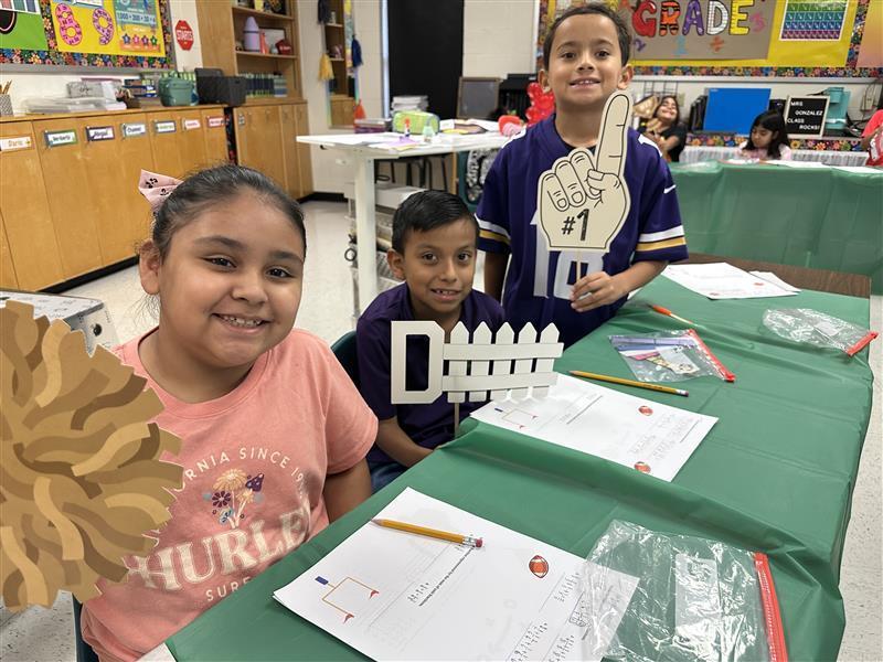 Kids posing for math activity.