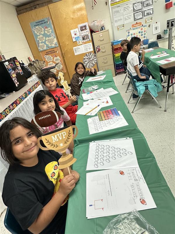 Kids posing for math activity.